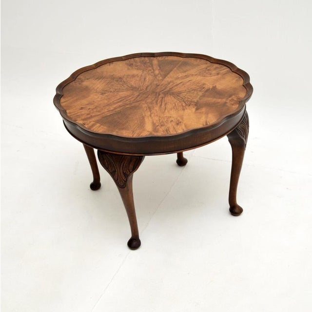 A lovely antique figured walnut pie crust coffee table. This was made in England, it dates from the 1920-30’s. It is of...