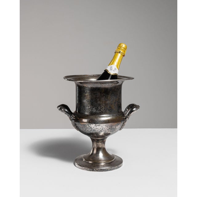 This mid 20th century ice bucket from France is finished in silver. Its form follows honest, well-proportioned lines...