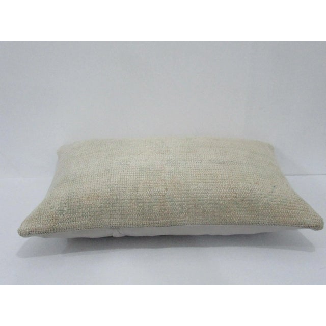 Decorative pillow cover made from a vintage Turkish handknotted rug. Backed with good quality cotton fabric. Pillow...