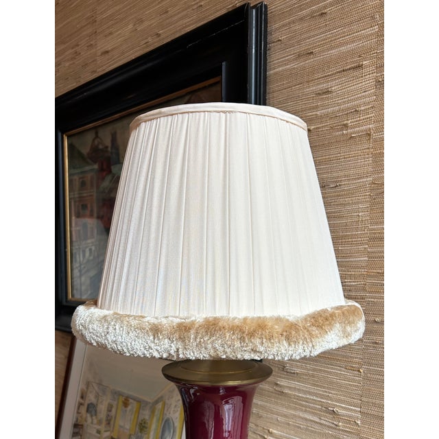 Pair of pleated baby pink lampshade made of sateen fabric with light brown caterpillar trim. Top: 8.5" across Bottom: 14"...