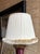Pair of pleated baby pink lampshade made of sateen fabric with light brown caterpillar trim. Top: 8.5" across Bottom: 14"...