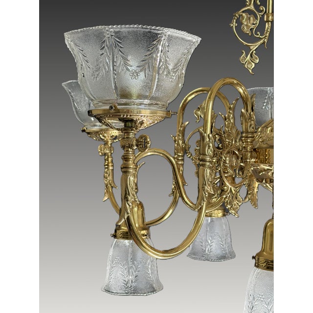 Timeless, refined, and beautifully crafted, this vintage 11-light brass chandelier features elegantly pressed pebbled...