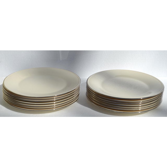 Set of 14 Vintage Lenox beige fine porcelain dinner plates with a Silver-Platinum trim, likely from a plain-edged pattern...