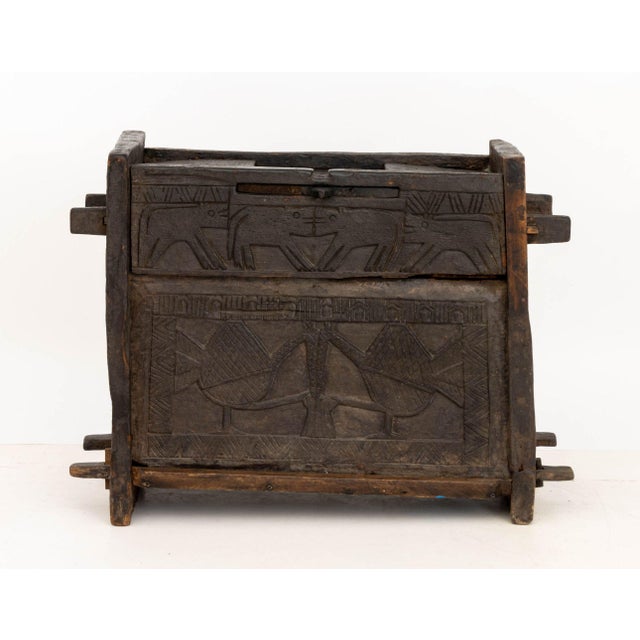 Carved Hardwood Dowry Chest, with central carved top pull handle to open and relief carved animal motif to the front....