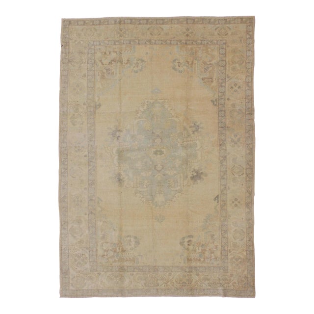 Oushak Vintage Turkish Rug With Faded Central Medallion Design in Cream Colors For Sale