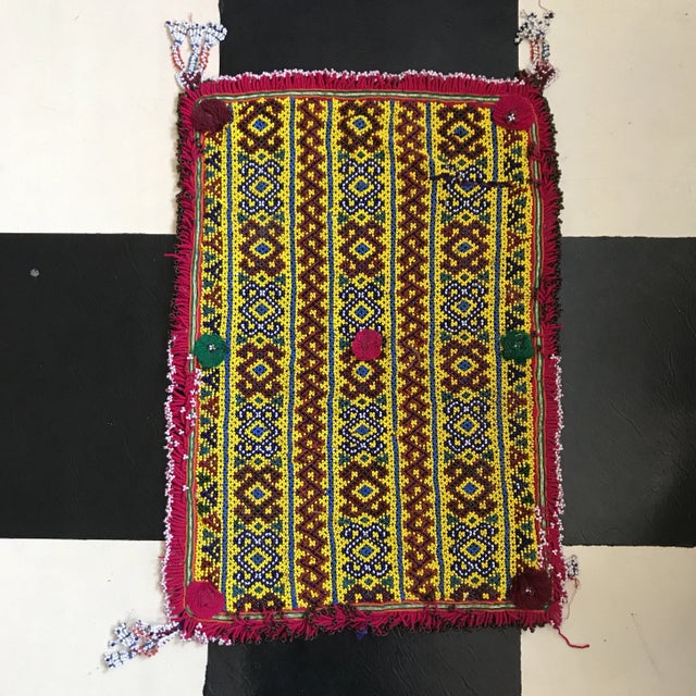 Vintage glass beaded hand embroidered African Tribal textile fragment. Beaded fringe and pom pom adornment. Needs repair...