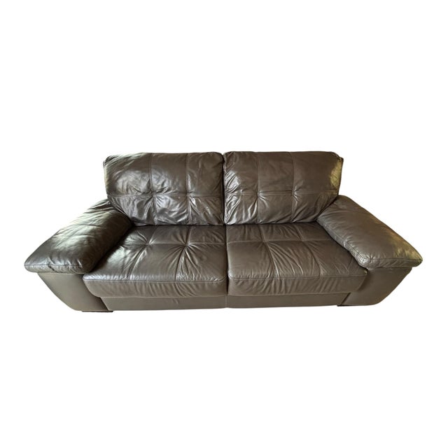 Handsome Chateau d’Ax two-seat leather sofa (fits 4 comfortably) with a rich charcoal gray finish, oversized pillow arms,...
