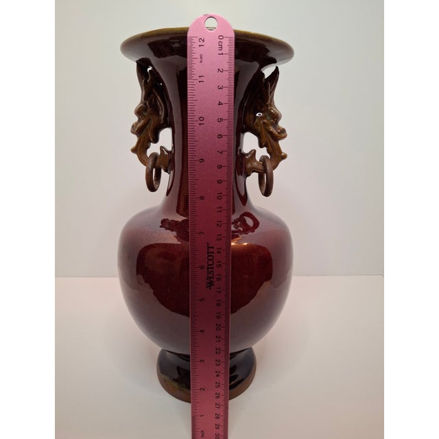 A superb 19th-century Chinese porcelain Hu-form vase featuring a rich, deep Sang de Boeuf (Oxblood) glaze. This piece...