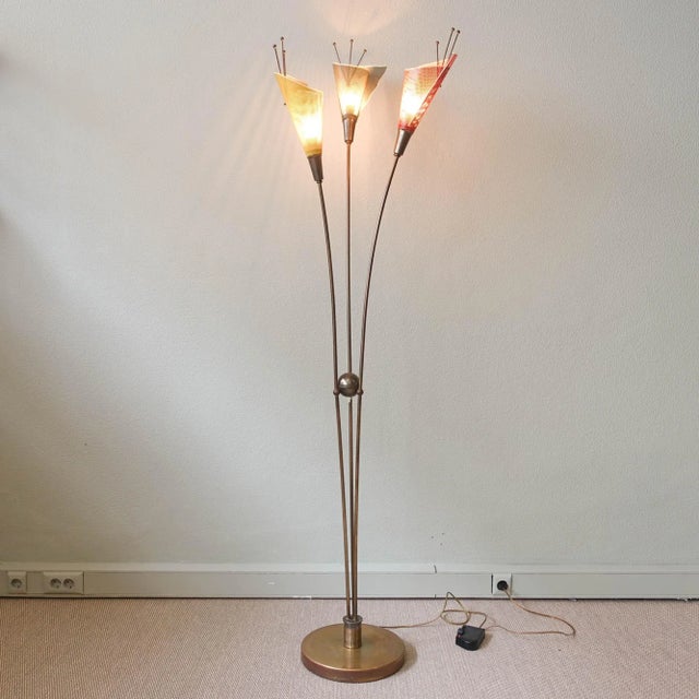 This floor lamp was designed and produced by Kobis & Lorence in France during the 1950's. It has three perforated metal...