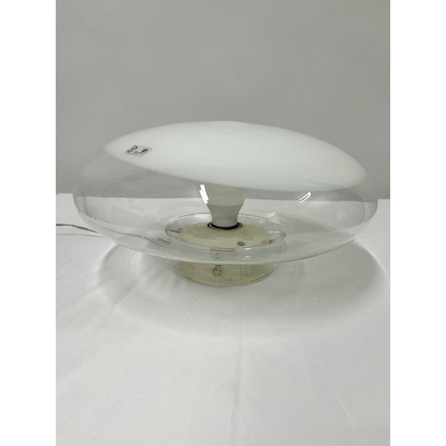 The "Gill" ceiling lamp, designed by Roberto Pamio for LEUCOS in 1962, is the first edition featuring a white ABS plastic...