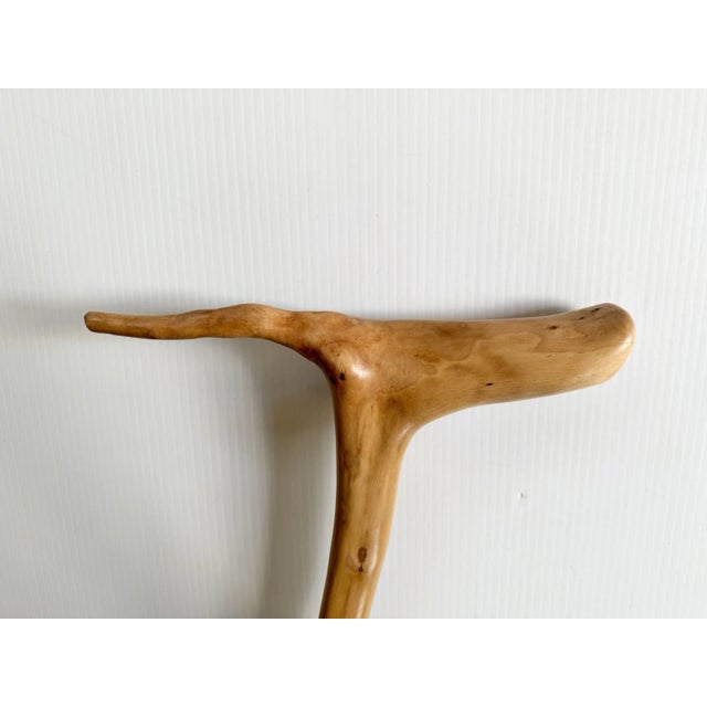 Unique and attractive walking stick with a natural T shaped handle. Bark has been removed and the wood has been sanded...