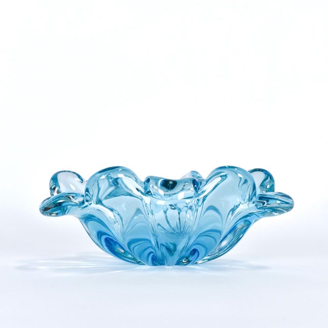 This Murano style blue bowl is from Italy, and possibly by Sommerso. It is unmarked but was imported from Italy. It is in...
