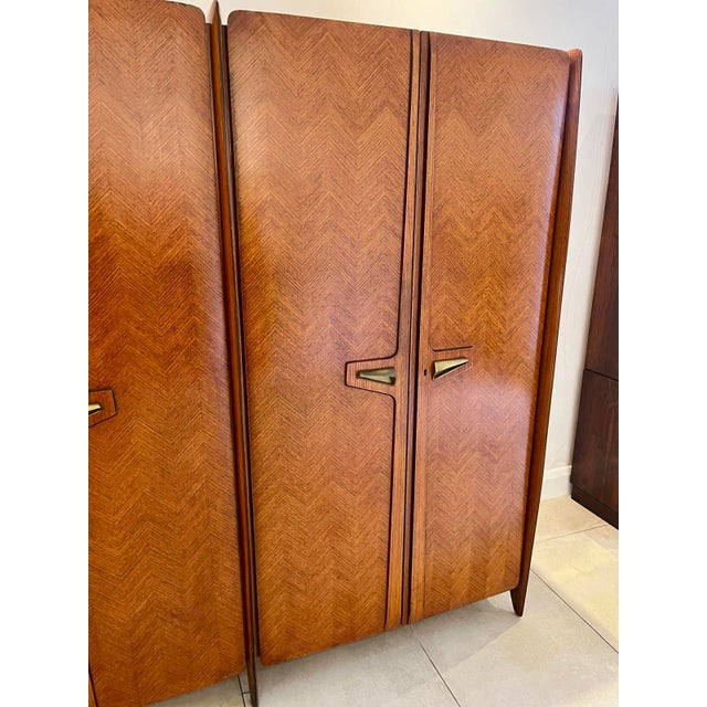 Rare 1950s Italian Triple Wardrobe by La Permanente Mobili Cantù. Elegant and rare six-door Italian wardrobe from the...