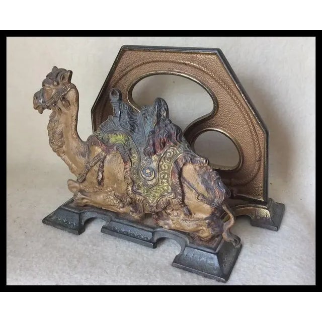An Antique Art Deco, Antique Egyptian Revival desk top Letter Holder decorated with a Camel. The Letter Holder is made of...