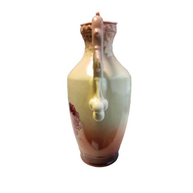 Beautifully handpainted and gilded Austrian wine pitcher, circa 1910-30, in excellent condition. Floral motif, berries...