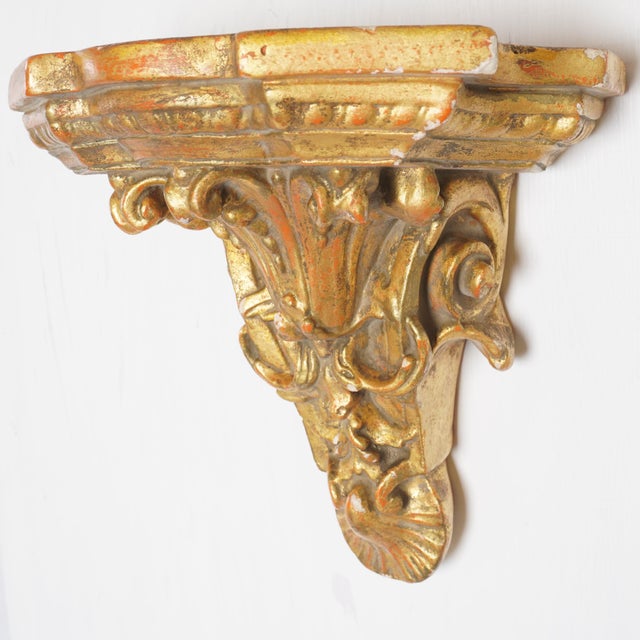 Exuding Old World elegance, this Vintage Italian Rococo Gilt Wall Shelf showcases intricate craftsmanship and ornate...