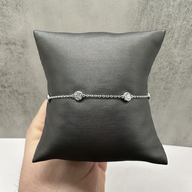 This diamond station bracelet is crafted in 14kt white gold and features a timeless station design accented with 0.90...
