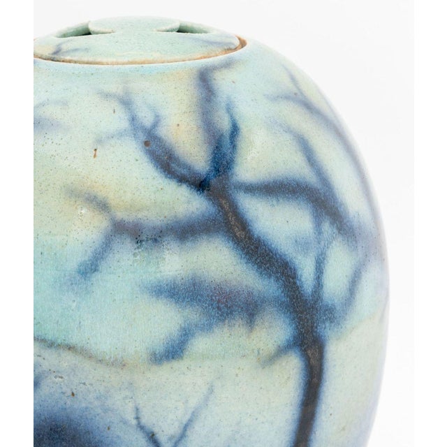 Modern Glazed Art Pottery Covered Jar, the circular lid with half-moon cut-out handles and blue onyx glaze, signed...