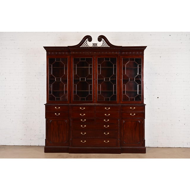 An outstanding English Georgian or Chippendale style monumental breakfront bookcase cabinet with drop front secretary desk...