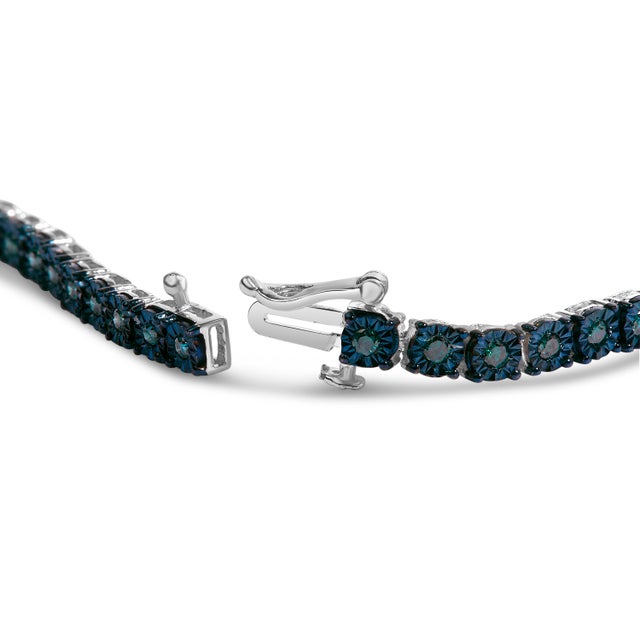 Delve into the depths of elegance with this entrancing blue diamond tennis bracelet, where vintage charm meets...