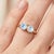 Capture the magic of the night sky with this mesmerizing 18k gold-plated two-stone ring. Featuring a pair of brilliant-cut...