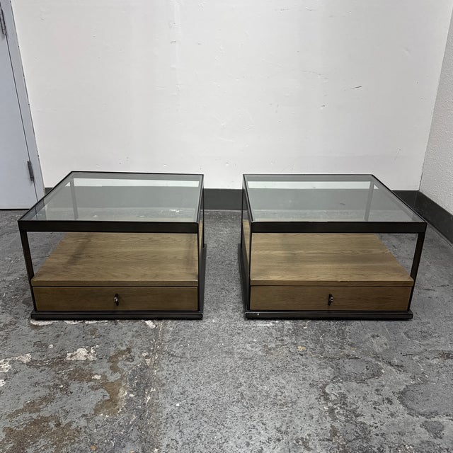 Design Plus Gallery presents the Pair of Carlson Bunching Tables from Four Hands. Each table pairs a clear glass top with...