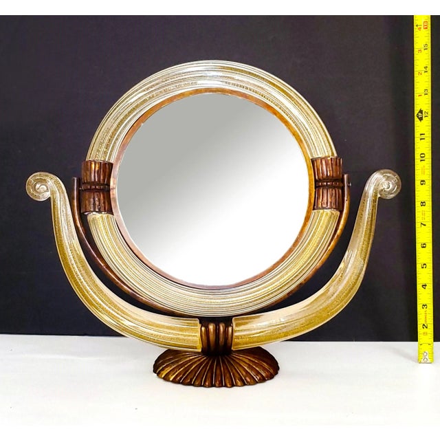 Offering a RARE vintage Murano glass vanity table mirror made by Barovier & Toso, circa 1950s. This remarkable mirror is...