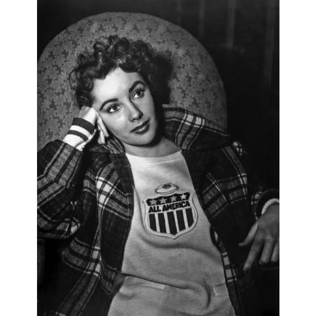 Thoughtful Elizabeth Taylor This black and white capture features thoughtful Elizabeth Taylor looking away from the movie...