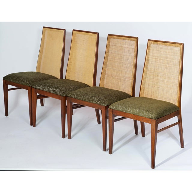 This stunning set of 4 mid-century modern walnut dining chairs, designed by the legendary American designer Milo Baughman...