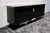 Art Deco High-Gloss Black Lacquered Sideboard with Stylized Woman's Head Emblem, 1930s, in Restored conditions. Designed...