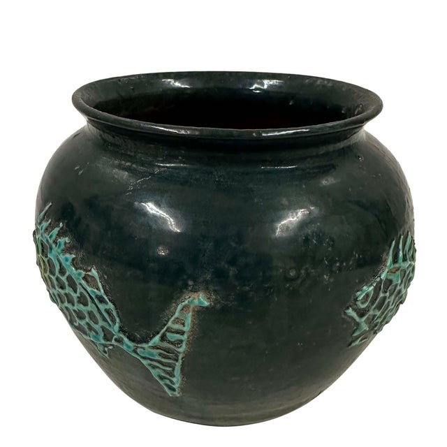 This striking vintage deep green glazed ceramic jar from China has beautiful traditional pattern detail around edge. It...