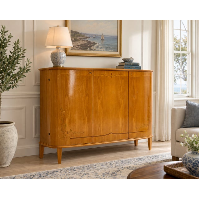 Large Swedish birch cabinet from the 1930s in elegant Swedish Grace style, with softly curved lines, beautiful birch and...