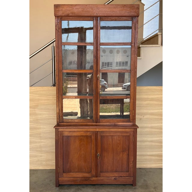 19th century Spanish cupboard or bookcase with glass vitrine, constructed from a pine called "mobila" and original glasses...