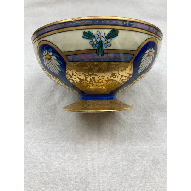 This is a beautifully delicate Pickard China bowl that is hand painted with a gold interior and base. The exterior is...