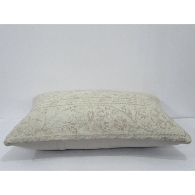 Decorative pillow cover made from a vintage Turkish handknotted rug. Backed with good quality cotton fabric. Pillow...
