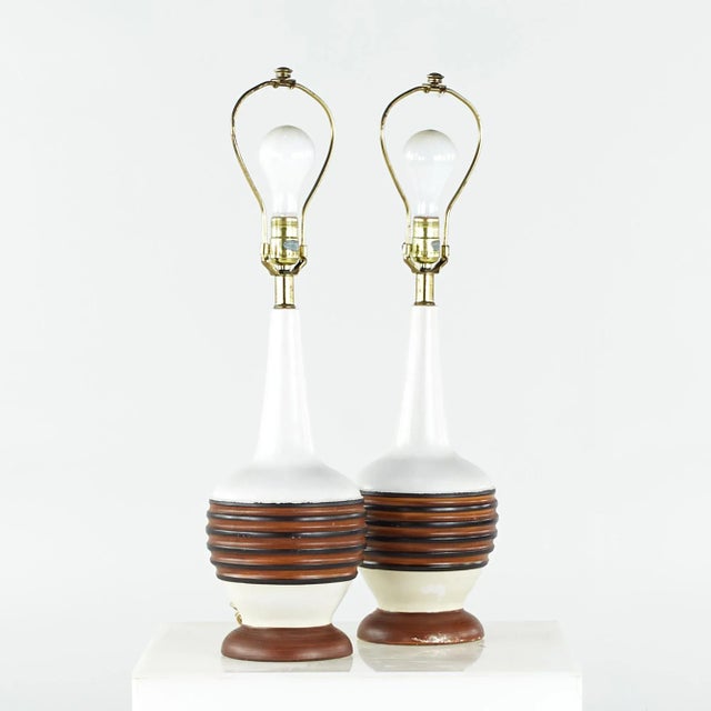 Mid Century Table Lamps - Pair Each table lamp measures: 7.5 wide x 7.5 deep x 27 inches high We take our photos in a...