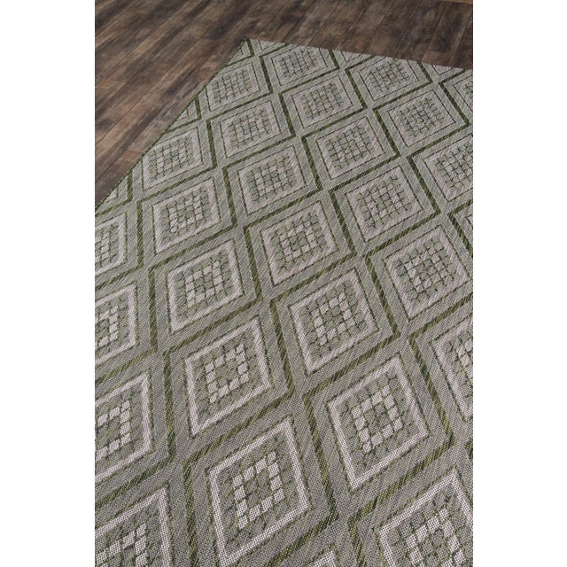 Weatherproof and wildly chic, this indoor/outdoor area rug is interior elegance outfitted for the backyard. The geometric...