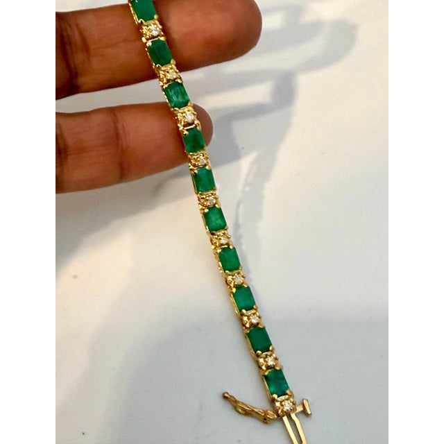 Approximately 9 Carat Emerald cut Emeralds & Diamond Tennis Bracelet 14 Karat Yellow Gold 7 & 1/2 Inches This...