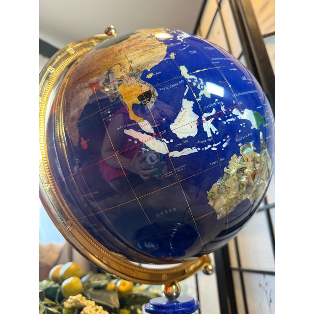 Fabulous vintage globe is bejeweled with precious and semi precious stones. This globe is large (24 in across) and comes...