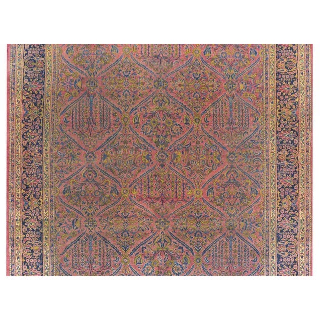 An outstanding early 20th century Persian Sarouk rug with a fantastic all-over trellis pattern containing weeping willows...