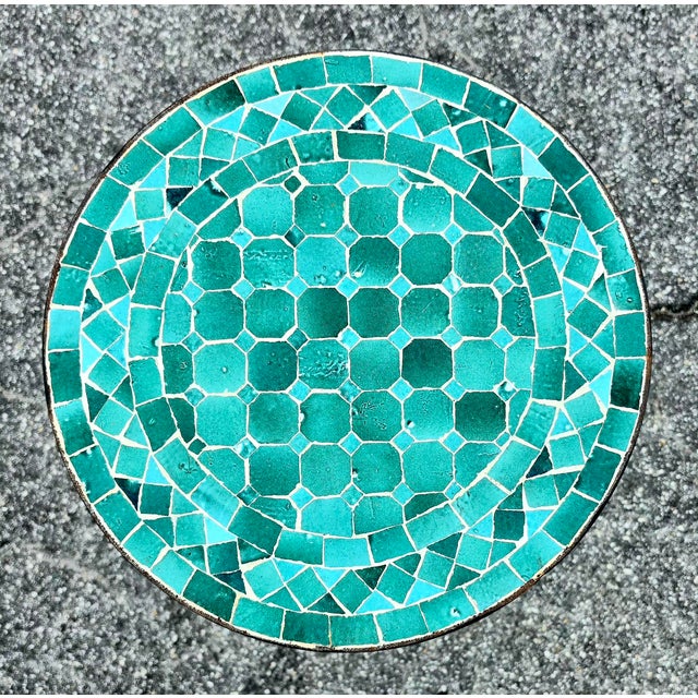 Add a pop of color and handcrafted charm to your home or patio with this beautiful emerald aqua mosaic accent table....
