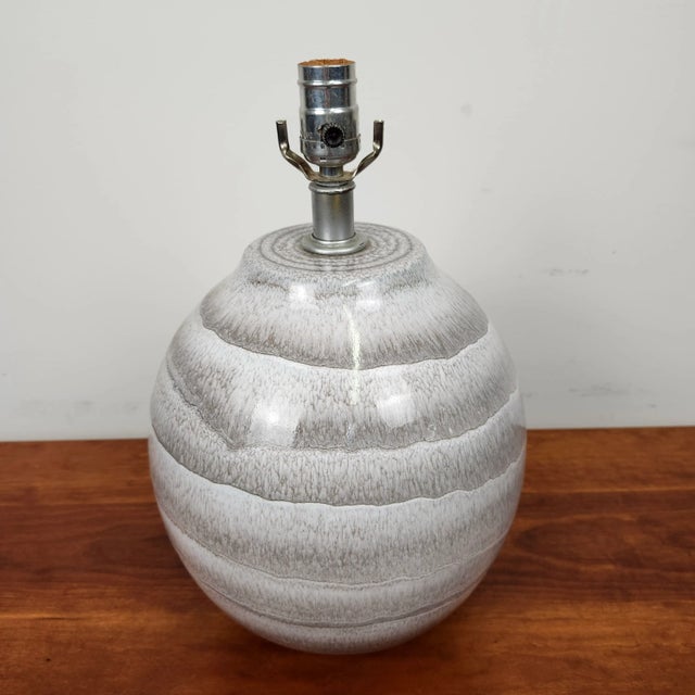 Lovely grey tone, smooth sphere form lamp by Lee Rosen for Design Technics. The glaze has beautiful layers of grey with...