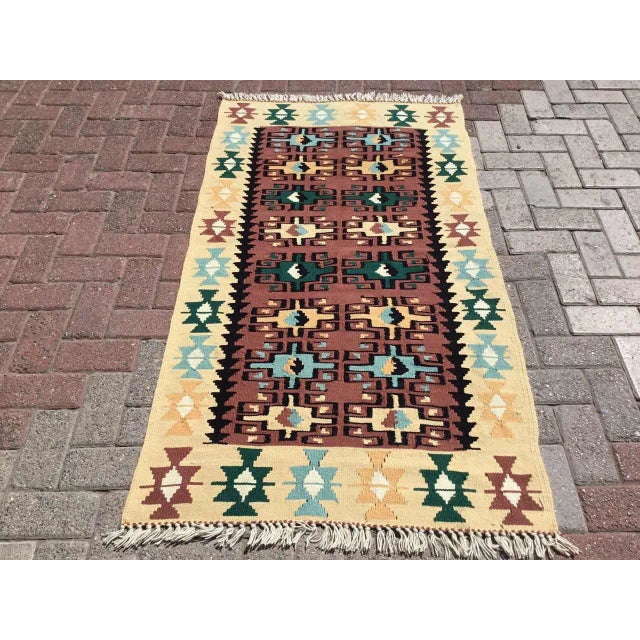 This beautiful, vintage, handwoven kilim is approximately 60 years old. It is handmade, of very fine quality hand spun...