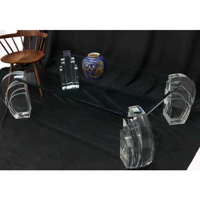 Mid-Century Modern rectangular cut corner top glass lucite base coffee table.