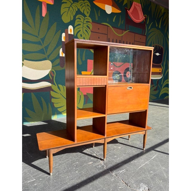 This piece is a great functional piece of furniture, both a room divider and shelving unit. Finished on all sides, so easy...