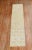 A mid 20th Century hand-knotted one of a kind Turkish runner predominantly light yellow.