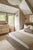 Debi plays with layers, texture, and tone to reveal a multi-dimensional silhouette. A linen drum shade serves as the base,...