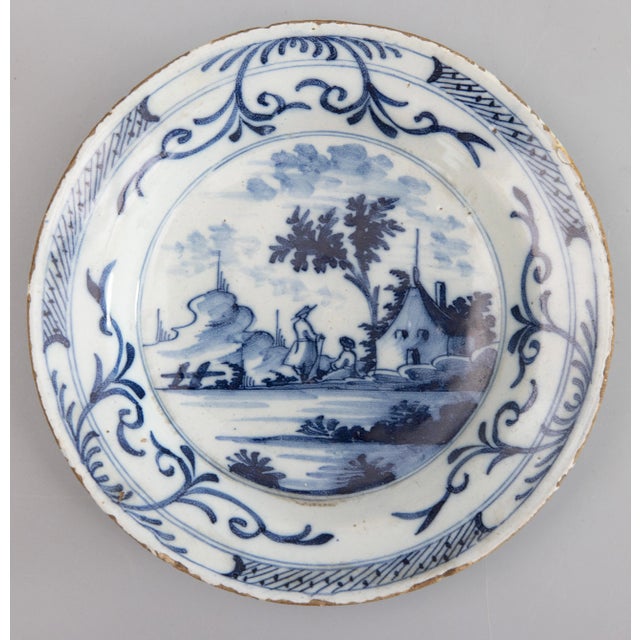 A rare pair of diminutive 18th-Century Dutch Delft faience Chinoiserie style plates with hand painted lovely cobalt blue...