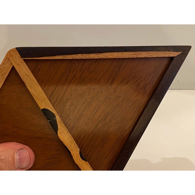 Beautifully made Rosewood Jewelry Box. 2 Triangular Lids open to reveal a velvet lined interior. Carved handle makes it...