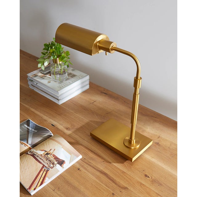 The Kenyon one light floor lamp in burnished brass by Chapman & Myers were designed to be highly versatile in their...